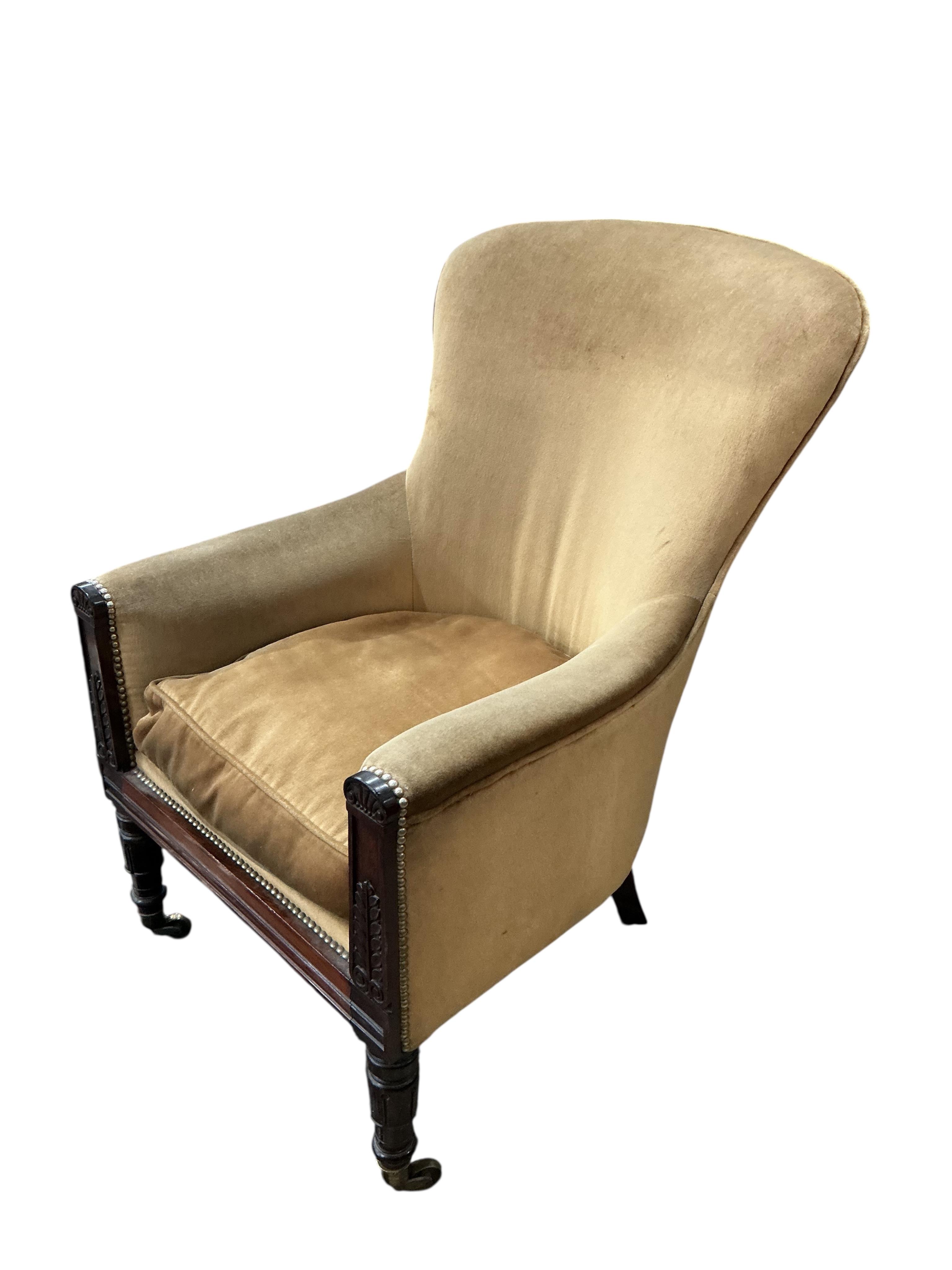 A William IV rosewood spoon back upholstered armchair, width 64cm, depth 68cm, height 104cm